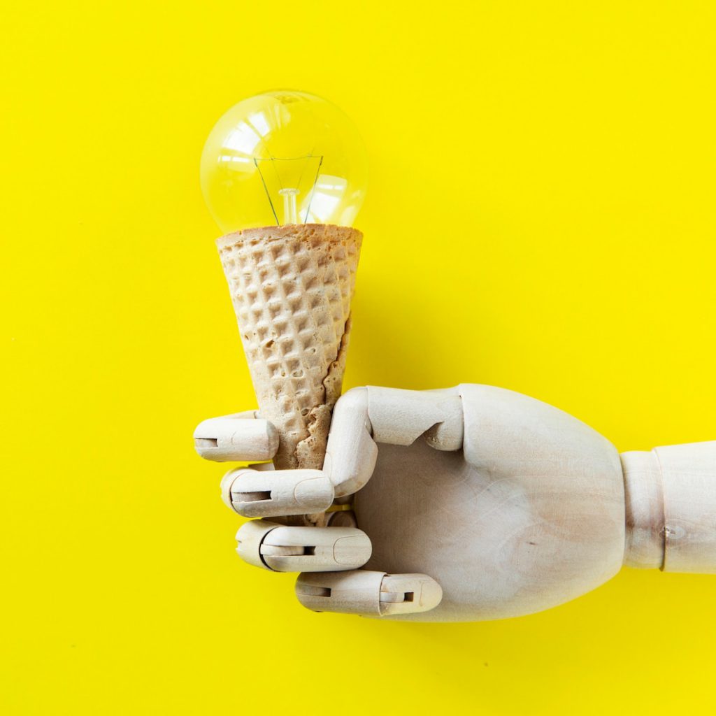 robot hand holding light bulb ice cream 53876 146268